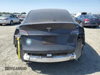 2024 Tesla Model Y Long Range z VIN 7SAYGAEE0RF101971, wystawiony jako Copart lot #58794335 z przebiegiem 16 099 mil mil oraz Szkoda całkowita • Salvage title. Historia ofert i sprzedaży dostępna na DreamBid. Obrazek 6.