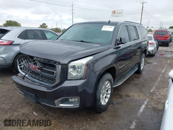 2015 GMC Yukon XL SLT with VIN 1GKS1HKC8FR219289, listed as a IAAI auction lot 40772496 with 163,477 mi miles. Bid and sale history available at carsss.com. Image 2.
