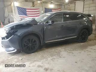 2021 Mazda CX-9 Grand Touring z VIN JM3TCBDYXM0516394, wystawiony jako Copart lot #52505215 z przebiegiem Nie podano mil oraz Szkoda całkowita • Salvage title. Historia ofert i sprzedaży dostępna na DreamBid. Obrazek 1.