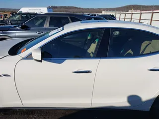 2014 Maserati Ghibli S Q4 with VIN ZAM57RTA1E1096387, listed as a IAAI auction lot 41424049 with 100,970 mi miles. Bid and sale history available at carsss.com. Image 14.