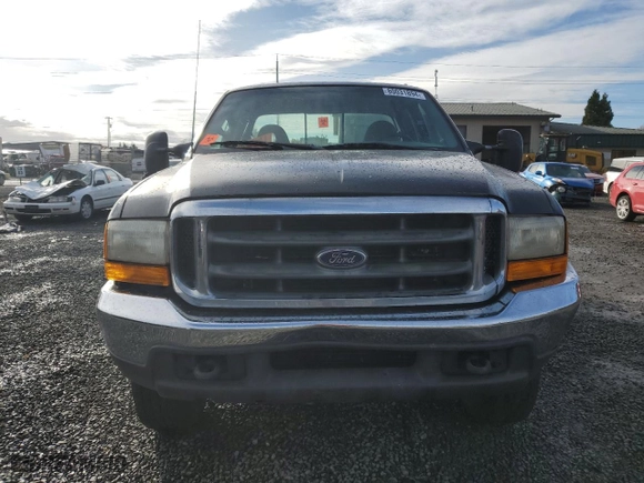 1999 Ford Super Duty F-250 XL with VIN 1FTNX21S7XED85129, listed as a Copart auction lot 80031894 with 176,769 mi miles and Salvage Title. Bid and sale history available at carsss.com. Image 5.