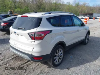 2017 Ford Escape Titanium with VIN 1FMCU9JD9HUB40135, listed as a IAAI auction lot 42054533 with 68,255 mi miles. Bid and sale history available at carsss.com. Image 4.