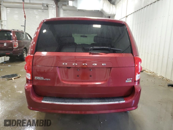 2014 Dodge Grand Caravan SXT z VIN 2C4RDGCG2ER239110, wystawiony jako Copart lot #57247855 z przebiegiem 94 126 mil mil oraz Nie do naprawy. Historia ofert i sprzedaży dostępna na DreamBid. Obrazek 6.
