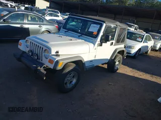 2004 Jeep Wrangler Sport Right Hand Drive with VIN 1J4F449S74P732854, listed as a IAAI auction lot 41408316 with 112,064 mi miles. Bid and sale history available at carsss.com. Image 17.