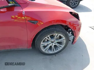2023 Tesla Model Y Long Range z VIN 7SAYGAEE7PF691499, wystawiony jako IAAI lot #42038850 z przebiegiem 26 439 mil mil oraz . Historia ofert i sprzedaży dostępna na DreamBid. Obrazek 21.