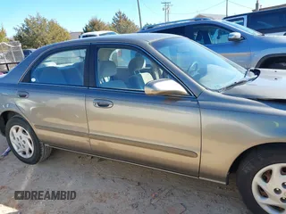 1999 Mazda 626 LX with VIN 1YVGF22D8X5871485, listed as a IAAI auction lot 41641049 with 115,603 mi miles. Bid and sale history available at carsss.com. Image 13.