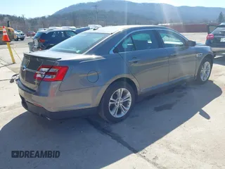 2014 Ford Taurus SEL with VIN 1FAHP2E82EG162676, listed as a IAAI auction lot 41795220 with 125,491 mi miles. Bid and sale history available at carsss.com. Image 4.