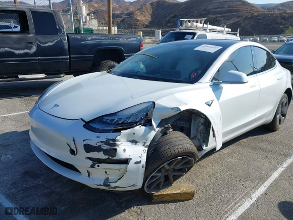 2020 Tesla Model 3 Standard Range Plus with VIN 5YJ3E1EA1LF615250, listed as a IAAI auction lot 41444030 with 76,810 mi miles. Bid and sale history available at carsss.com. Image 19.