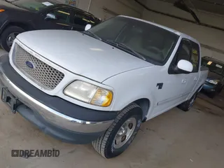 2001 Ford F-150 XLT with VIN 1FTRW07LX1KD77186, listed as a IAAI auction lot 42564774 with 190,647 mi miles and . Bid and sale history available at DreamBid. Image 2.
