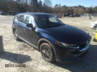 2019 Mazda CX-5 Touring with VIN JM3KFBCM5K0633668, listed as a IAAI auction lot 41617142 with 57,809 mi miles. Bid and sale history available at carsss.com. Image 1.