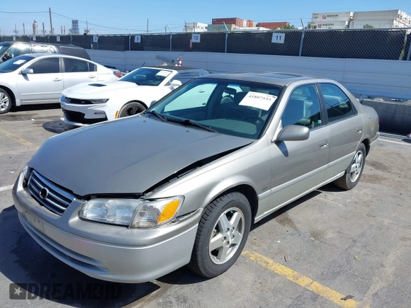 2001 Toyota Camry CE z VIN JT2BG22K210569246, wystawiony jako IAAI lot #41807555 z przebiegiem 79 226 mil mil oraz . Historia ofert i sprzedaży dostępna na DreamBid. Obrazek 2.