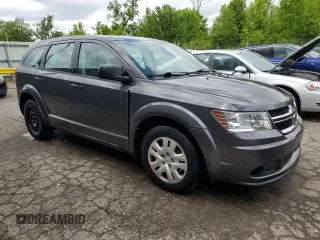 2014 Dodge Journey American Value with VIN 3C4PDCAB1ET135504, listed as a Copart auction lot 58803645 with 164,501 mi miles and Clean title. Bid and sale history available at DreamBid. Image 4.