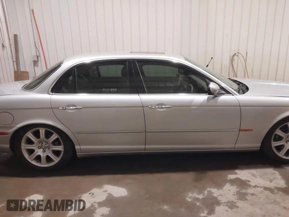 2004 Jaguar XJ with VIN SAJWA71C04SG33993, listed as a IAAI auction lot 41193040 with 79,944 mi miles. Bid and sale history available at carsss.com. Image 13.