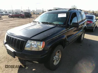 1999 Jeep Grand Cherokee Limited with VIN 1J4GW68N8XC770305, listed as a IAAI auction lot 41720558 with 206,180 mi miles. Bid and sale history available at carsss.com. Image 2.