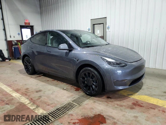 2023 Tesla Model Y Long Range z VIN 7SAYGDEE8PF814874, wystawiony jako Copart lot #56546365 z przebiegiem 20 919 mil mil oraz Szkoda całkowita • Salvage title. Historia ofert i sprzedaży dostępna na DreamBid. Obrazek 4.