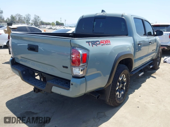 2022 Toyota Tacoma SR with VIN 3TYCZ5AN0NT104300, listed as a IAAI auction lot 42652503 with 18,071 mi miles and . Bid and sale history available at DreamBid. Image 4.