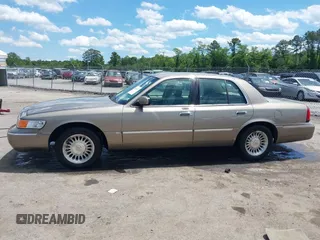2001 Mercury Grand Marquis LS z VIN 2MEFM75W31X704182, wystawiony jako IAAI lot #42086175 z przebiegiem 177 892 mil mil oraz . Historia ofert i sprzedaży dostępna na DreamBid. Obrazek 14.
