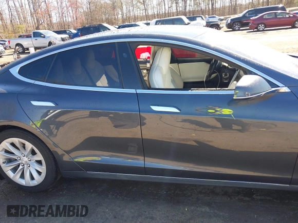 2017 Tesla Model S 100D with VIN 5YJSA1E22HF210635, listed as a IAAI auction lot 41854125 with 112,323 mi miles. Bid and sale history available at carsss.com. Image 14.