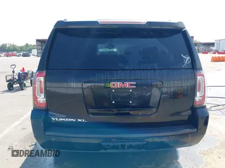 2016 GMC Yukon XL SLE with VIN 1GKS1FKC9GR161876, listed as a IAAI auction lot 39948106 with 60,800 mi miles. Bid and sale history available at carsss.com. Image 16.