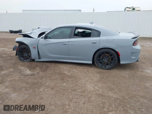 2020 Dodge Charger Scat Pack Widebody z VIN 2C3CDXGJ8LH216563, wystawiony jako IAAI lot #41502637 z przebiegiem Nie podano mil oraz . Historia ofert i sprzedaży dostępna na DreamBid. Obrazek 14.