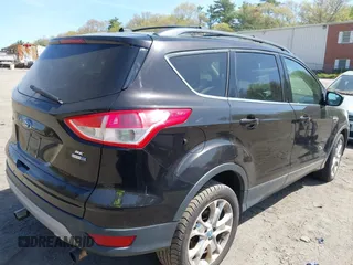 2013 Ford Escape SE with VIN 1FMCU9GX3DUA51379, listed as a IAAI auction lot 42175420 with 166,522 mi miles. Bid and sale history available at carsss.com. Image 4.