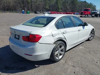 2014 BMW 3 Series 320i with VIN WBA3B1C59EP678908, listed as a IAAI auction lot 41774738 with 143,975 mi miles. Bid and sale history available at carsss.com. Image 4.