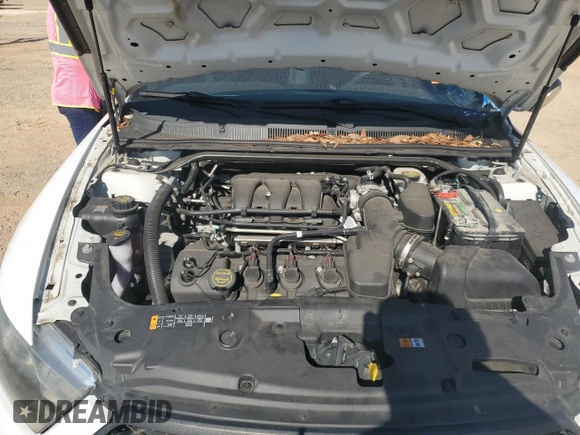 2015 Ford Police Interceptor with VIN 1FAHP2L80FG167962, listed as a Copart auction lot 77085564 with 121,447 mi miles and Salvage title. Bid and sale history available at DreamBid. Image 12.