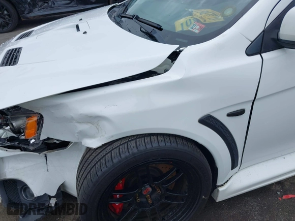 2013 Mitsubishi Lancer Evolution GSR z VIN JA32W8FV0DU023509, wystawiony jako IAAI lot #42222552 z przebiegiem 128 030 mil mil oraz . Historia ofert i sprzedaży dostępna na DreamBid. Obrazek 6.