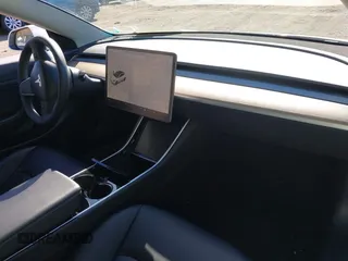 2020 Tesla Model 3 Standard Range Plus with VIN 5YJ3E1EA0LF783672, listed as a IAAI auction lot 41903431 with 52,157 mi miles and . Bid and sale history available at carsss.com. Image 5.