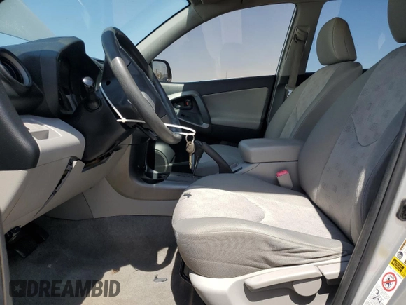 2009 Toyota RAV4 with VIN JTMZF33V39D007979, listed as a Copart auction lot 52054865 with 179,446 mi miles and Salvage Title. Bid and sale history available at DreamBid. Image 7.