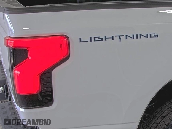 2022 Ford F-150 Lightning Pro with VIN 1FTVW1EL5NWG11725, listed as a IAAI auction lot 42832825 with 5,044 mi miles and . Bid and sale history available at DreamBid. Image 4.