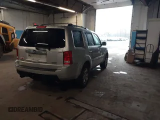 2009 Honda Pilot Touring with VIN 5FNYF48929B010331, listed as a IAAI auction lot 41965094 with 142,490 mi miles and . Bid and sale history available at carsss.com. Image 4.