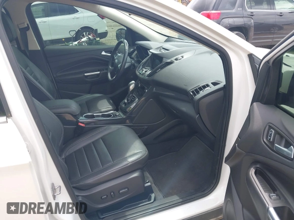 2016 Ford Escape Titanium z VIN 1FMCU9J90GUC76504, wystawiony jako IAAI lot #42552851 z przebiegiem 89 570 mil mil oraz . Historia ofert i sprzedaży dostępna na DreamBid. Obrazek 5.