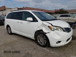 2012 Toyota Sienna XLE AAS with VIN 5TDYK3DC0CS250830, listed as a Copart auction lot 73323284 with 147,580 mi miles and Salvage Title. Bid and sale history available at DreamBid. Image 4.