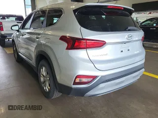 2019 Hyundai Santa Fe SE z VIN 5NMS2CADXKH044032, wystawiony jako IAAI lot #42289790 z przebiegiem 164 253 mil mil oraz . Historia ofert i sprzedaży dostępna na DreamBid. Obrazek 1.