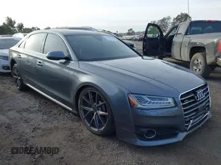 2016 Audi A8 L 4.0T Sport with VIN WAU43AFD1GN008031, listed as a IAAI auction lot 41390435 with 153,152 mi miles. Bid and sale history available at carsss.com. Image 1.
