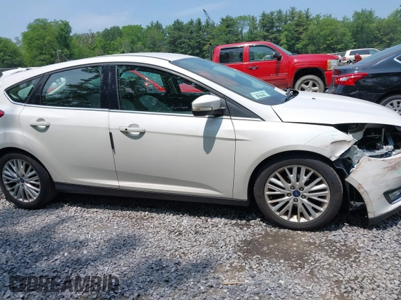 2016 Ford Focus Titanium with VIN 1FADP3N26GL332709, listed as a IAAI auction lot 42458997 with 75,509 mi miles and . Bid and sale history available at DreamBid. Image 13.