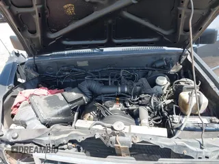 1992 Mitsubishi Mighty Max z VIN JA7FL24W9NP021503, wystawiony jako IAAI lot #41942559 z przebiegiem 162 088 mil mil oraz . Historia ofert i sprzedaży dostępna na DreamBid. Obrazek 10.