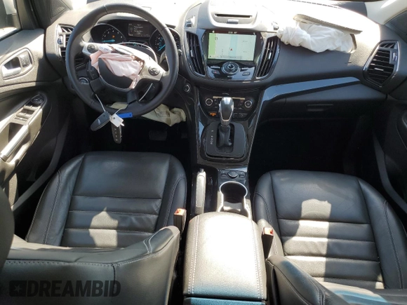 2016 Ford Escape Titanium with VIN 1FMCU9JX5GUC44579, listed as a Copart auction lot 54974965 with 113,776 mi miles and Salvage Title. Bid and sale history available at DreamBid. Image 8.