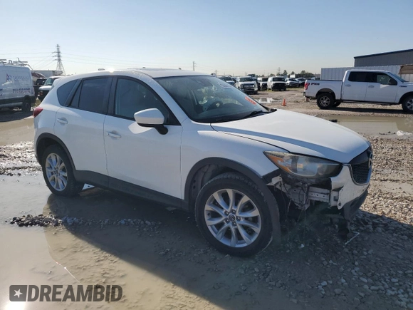 2015 Mazda CX-5 Grand Touring with VIN JM3KE2DY1F0453386, listed as a Copart auction lot 50580185 with 174,309 mi miles and Salvage Title. Bid and sale history available at carsss.com. Image 4.