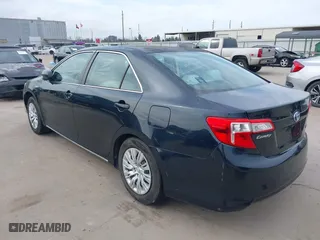 2013 Toyota Camry Hybrid LE with VIN 4T1BD1FK6DU070138, listed as a IAAI auction lot 41668658 with 148,065 mi miles. Bid and sale history available at carsss.com. Image 3.