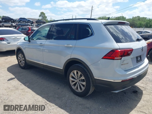 2018 Volkswagen Tiguan SEL with VIN 3VV3B7AX5JM053045, listed as a IAAI auction lot 41963017 with 77,495 mi miles and . Bid and sale history available at DreamBid. Image 3.