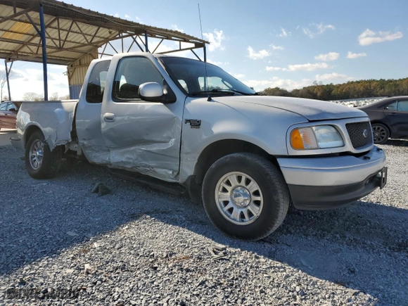 2003 Ford F-150 XL with VIN 1FTRX07W03KB17955, listed as a Copart auction lot 83061424 with 164,529 mi miles and Salvage Title. Bid and sale history available at carsss.com. Image 4.