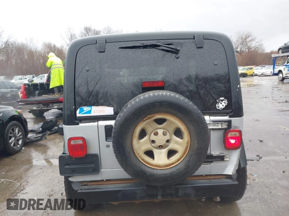 2006 Jeep Wrangler Sport Right Hand Drive with VIN 1J4F449SX6P764491, listed as a IAAI auction lot 41709726 with 290,798 mi miles. Bid and sale history available at carsss.com. Image 16.
