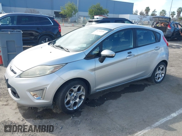 2011 Ford Fiesta SES with VIN 3FADP4FJ1BM102434, listed as a IAAI auction lot 41703287 with 124,476 mi miles. Bid and sale history available at carsss.com. Image 2.