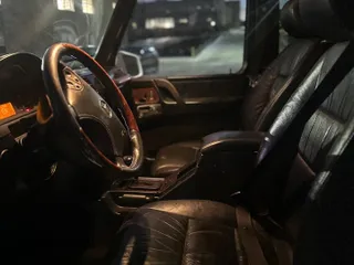 2002 Mercedes-Benz G-Class with VIN WDCYR49E22X132146, listed as a Copart auction lot 46248815 with 208,917 mi miles and Salvage Title. Bid and sale history available at carsss.com. Image 5.