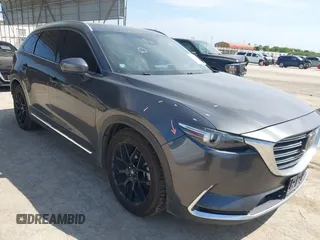 2016 Mazda CX-9 Grand Touring with VIN JM3TCADY5G0120033, listed as a IAAI auction lot 42248488 with 150,044 mi miles and . Bid and sale history available at DreamBid. Image 1.