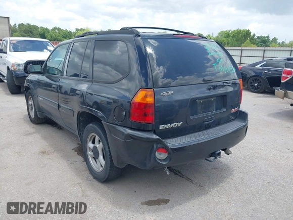 2005 GMC Envoy SLE with VIN 1GKDS13SX52373187, listed as a IAAI auction lot 42434190 with 112,965 mi miles and . Bid and sale history available at DreamBid. Image 3.