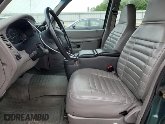 1999 Ford Explorer XL z VIN 1FMZU34X6XUC27678, wystawiony jako Copart lot #57073105 z przebiegiem 228 525 mil mil oraz Czysty tytuł • Clean title. Historia ofert i sprzedaży dostępna na DreamBid. Obrazek 7.