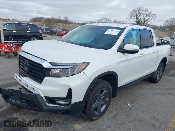 2023 Honda Ridgeline RTL with VIN 5FPYK3F55PB018188, listed as a IAAI auction lot 41952319 with 73,019 mi miles and . Bid and sale history available at DreamBid. Image 2.
